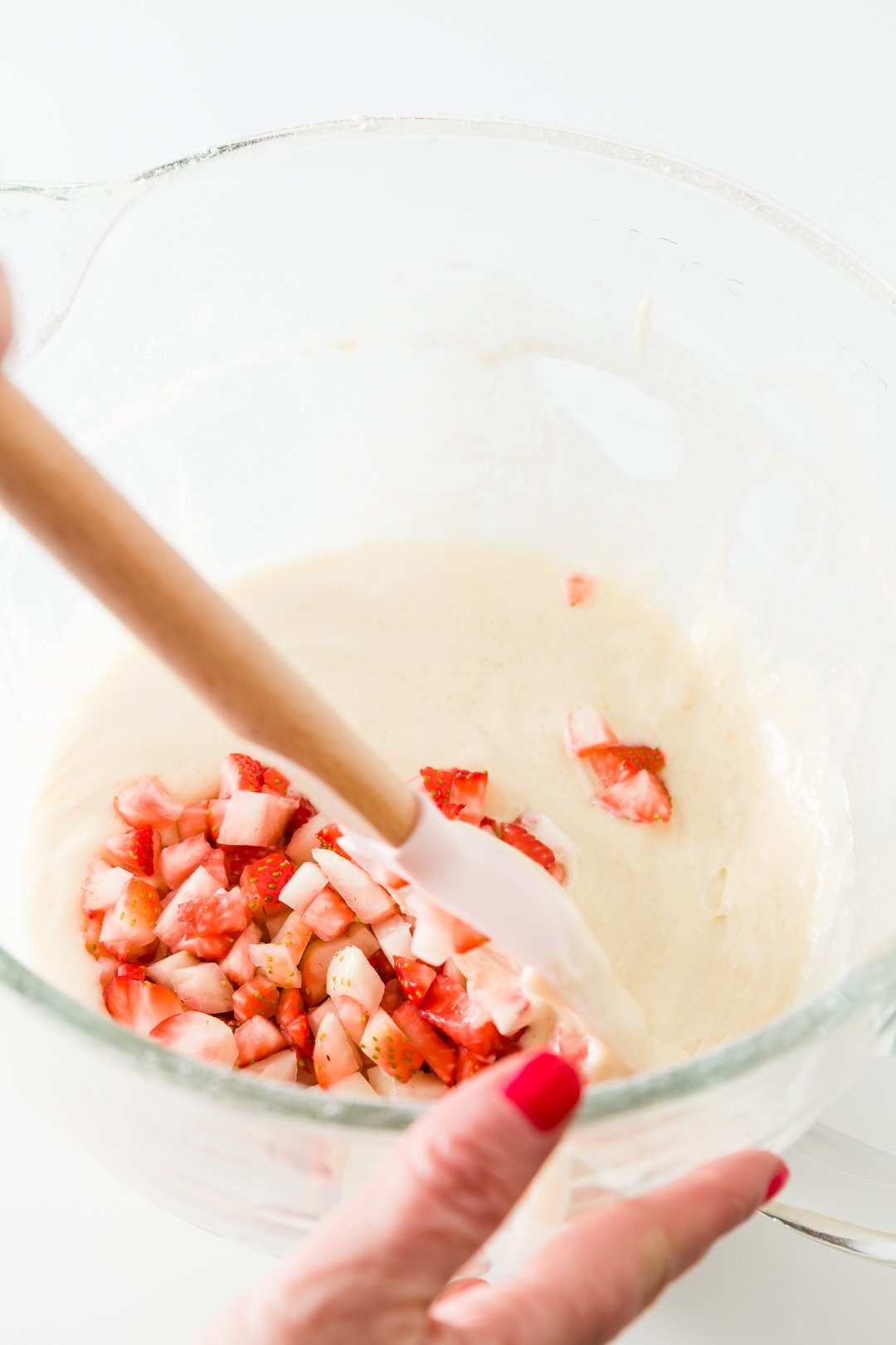 Mixing strawberries into batter 