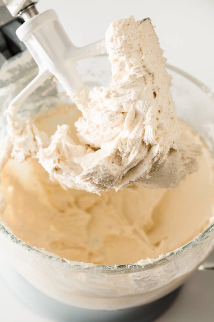 Vanilla buttercream frosting on a mixer paddle