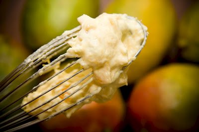 mango frosting on a whisk