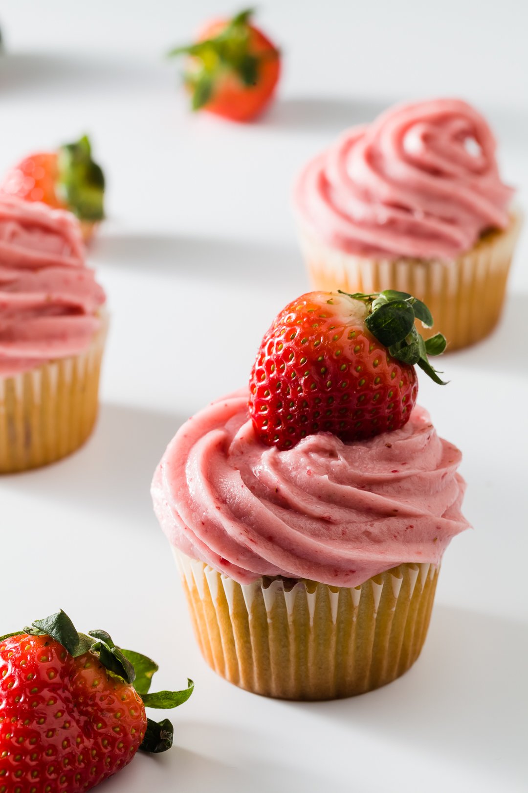 Vanilla Cupcakes With Strawberry Frosting