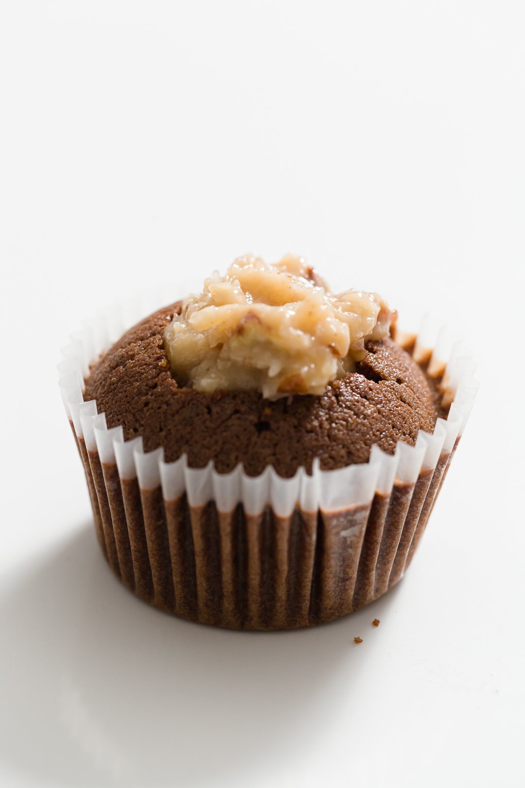 German chocolate cupcake right after being filled