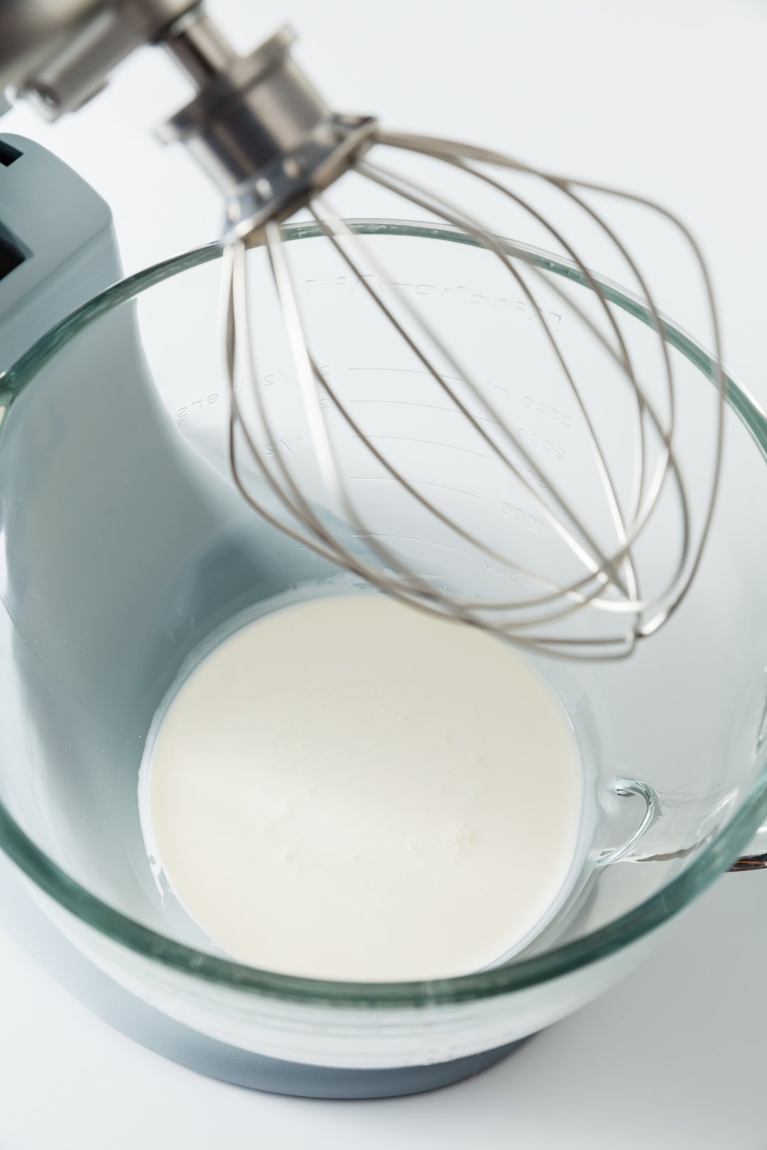 heavy whipping cream in the bowl of stand mixer with the whisk attachment
