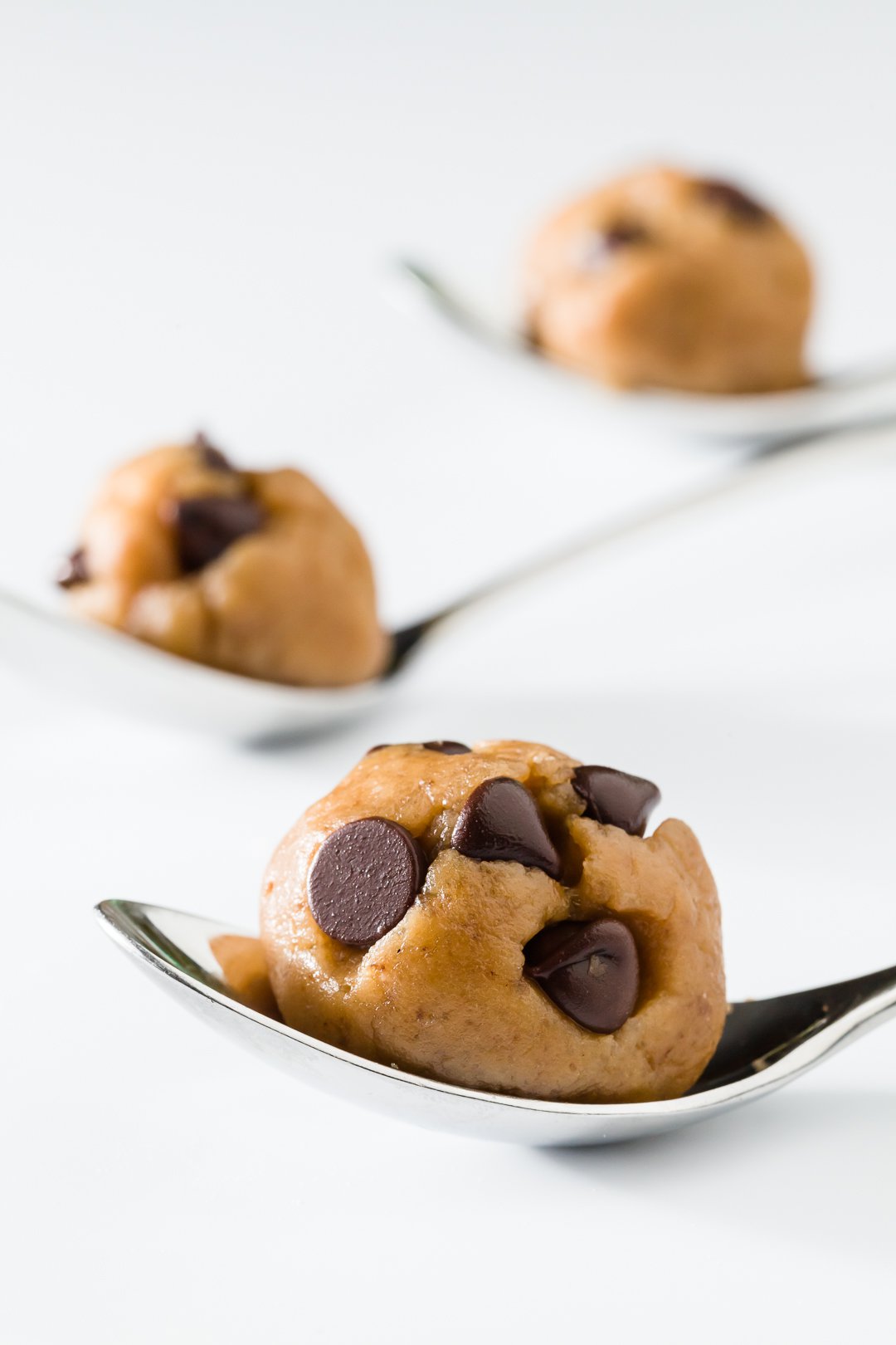 Chocolate chip cookie dough on a spoon