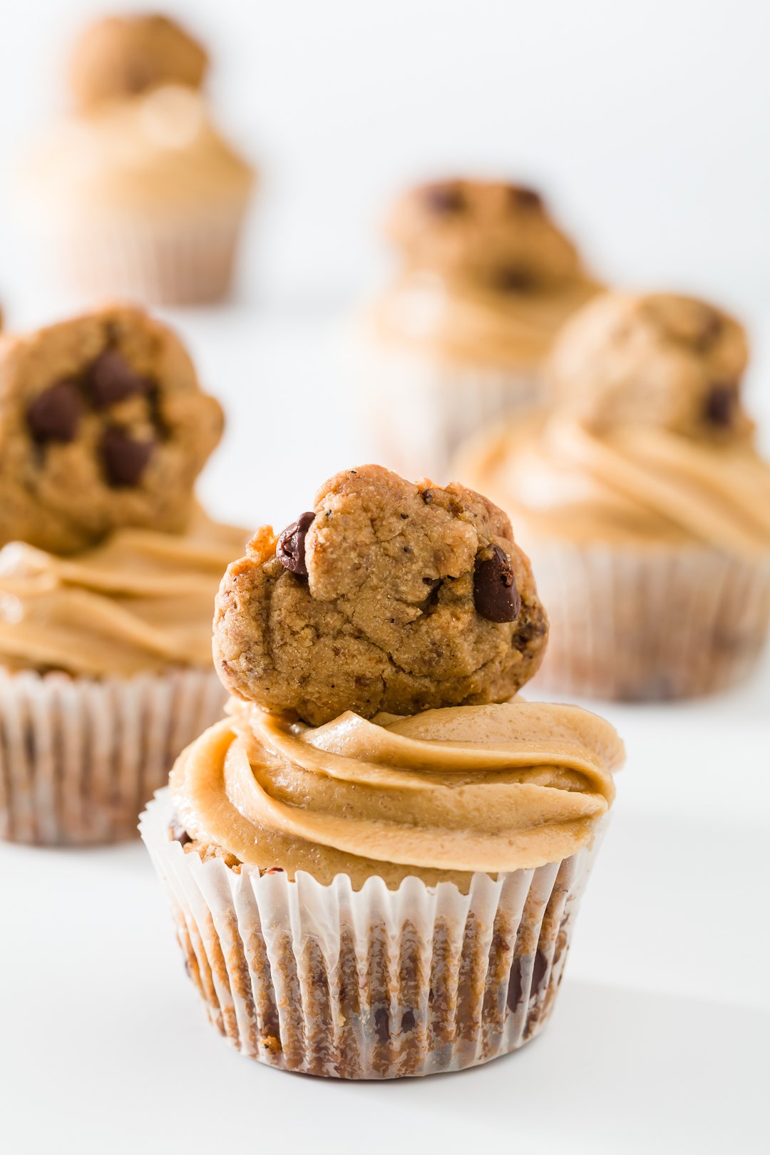 Cookie cupcakes with cookie dough frosting and a cookie on top