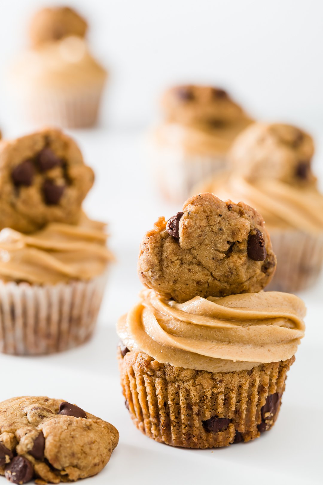 Cookie cupcakes on a white background with a cookie in the front