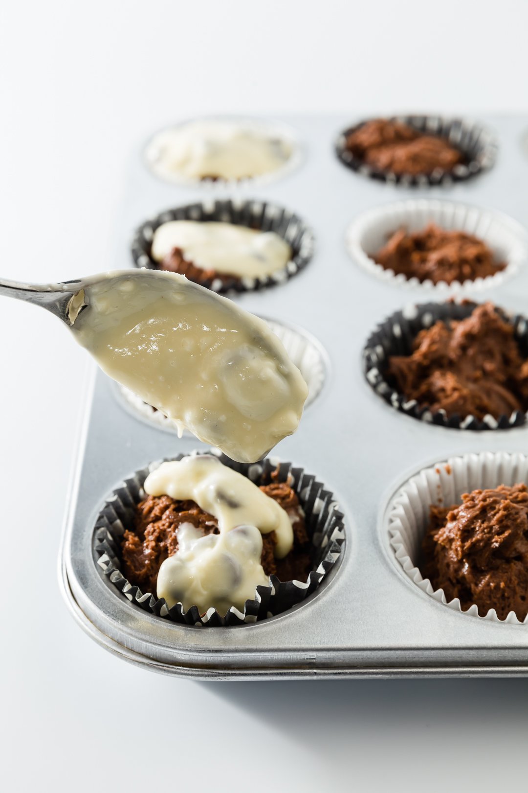 Prepping black bottom cupcakes for baking