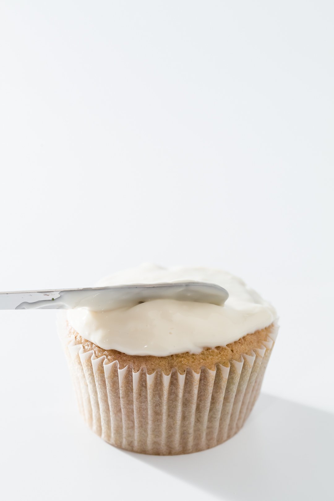 Spreading Greek yogurt frosting