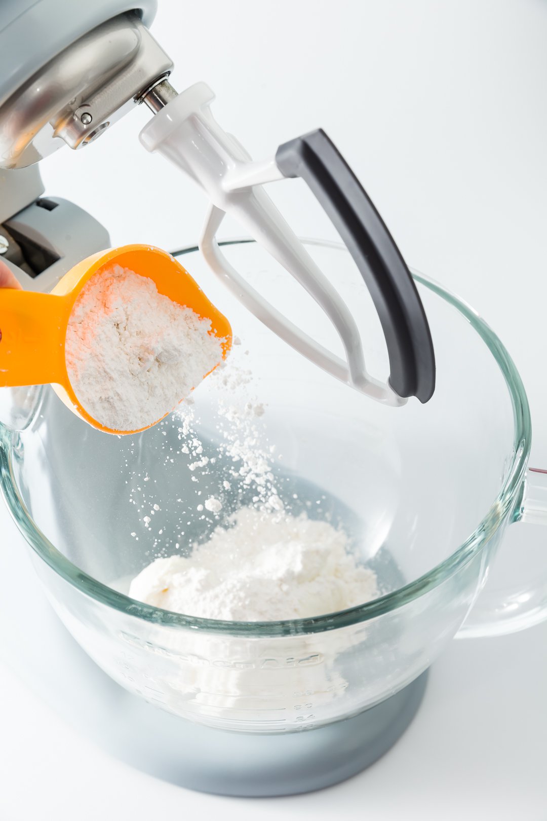 Mixing yogurt and powdered sugar