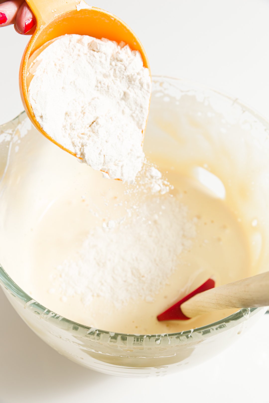 Adding flour to the batter