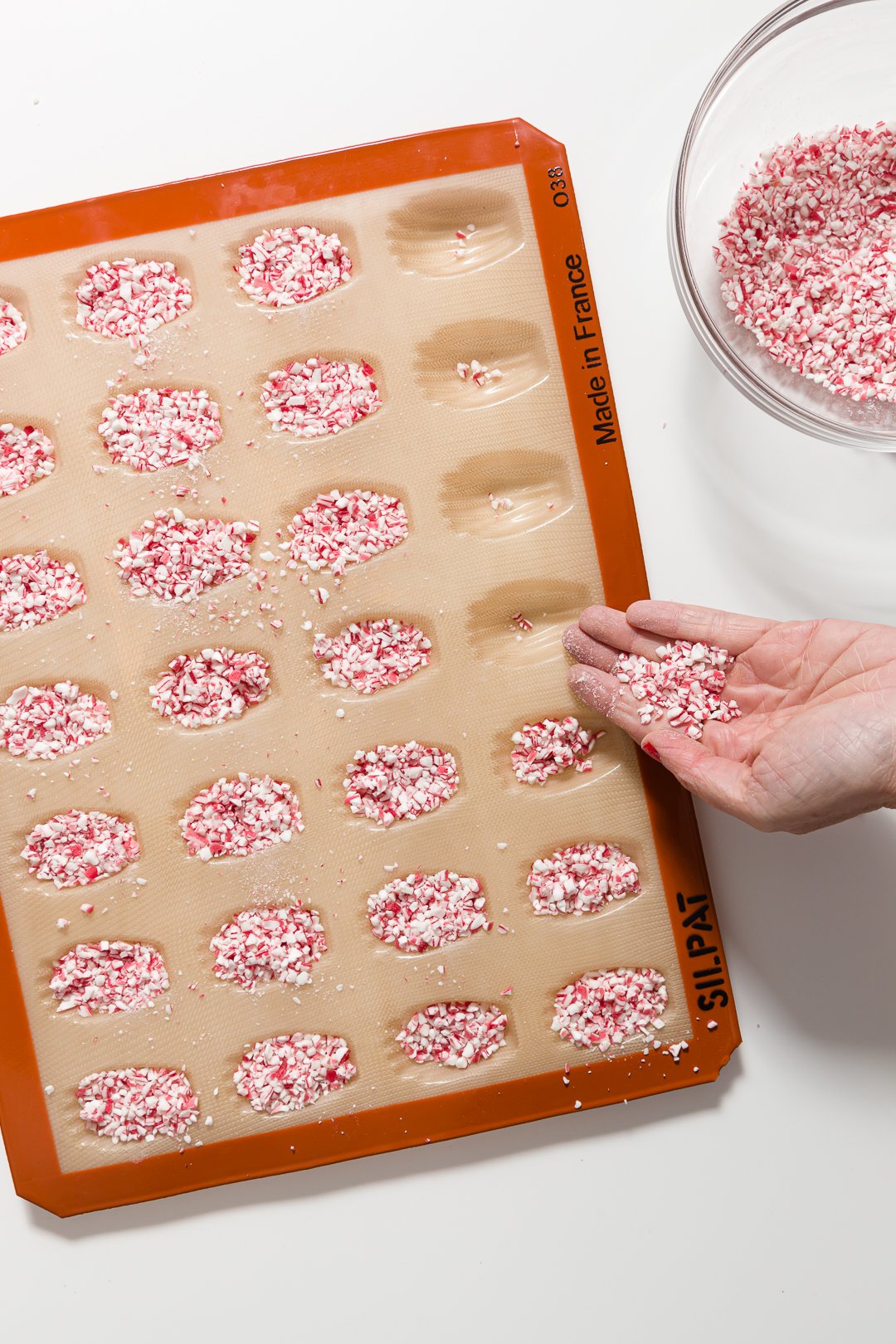 Filling Silpat with crushed candy canes