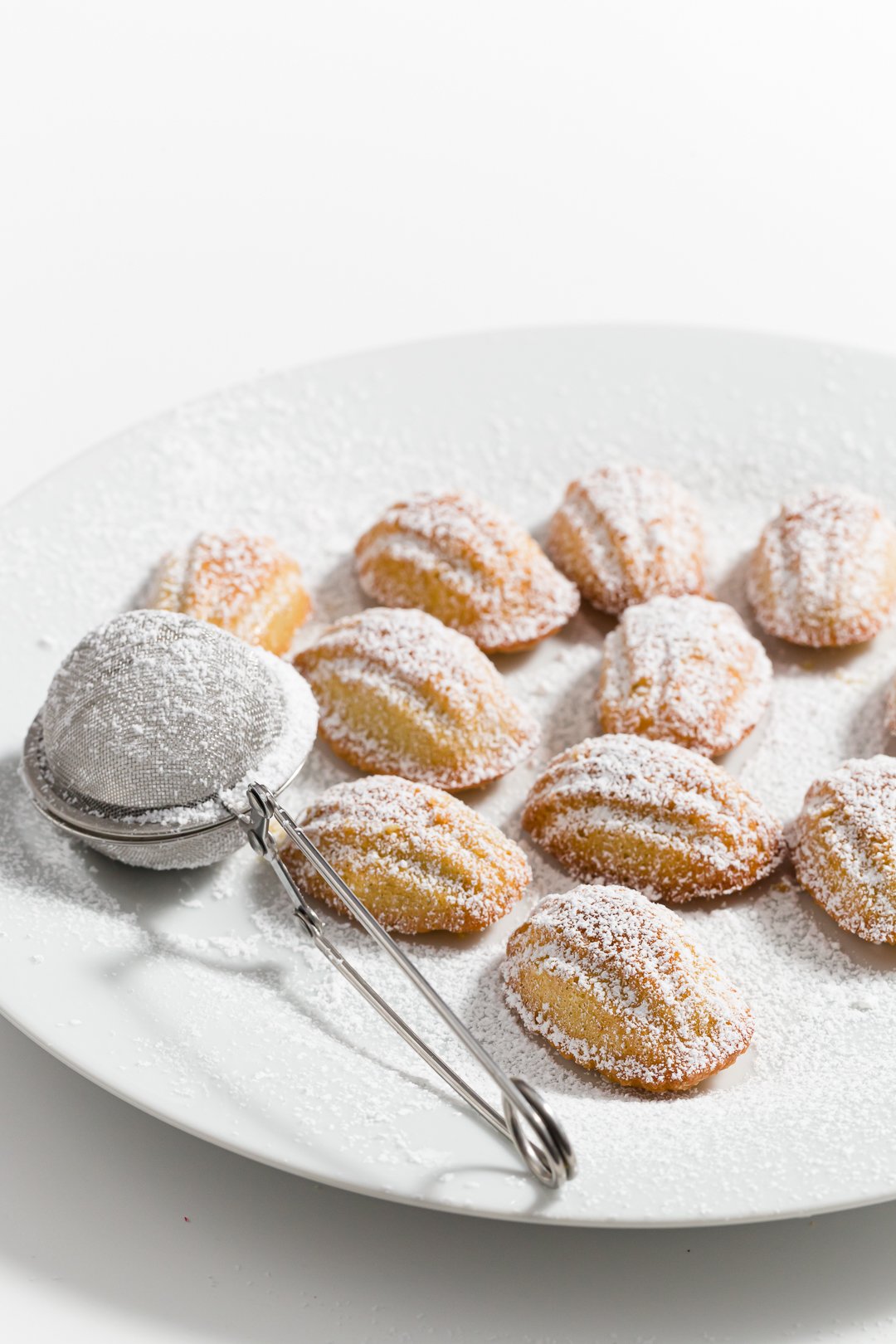 Mini madeleines dusted in powdered sugar