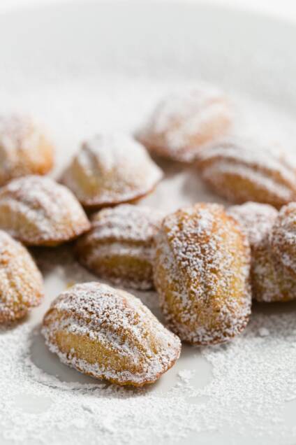 Mini Madeleines dusted with powdered sugar