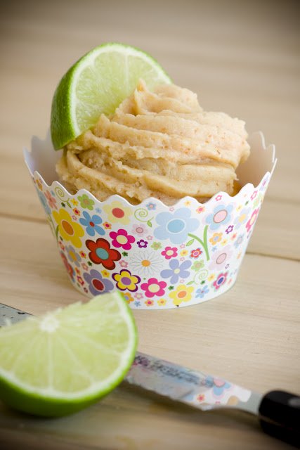 a key lime cupcake with a slice of a key lime