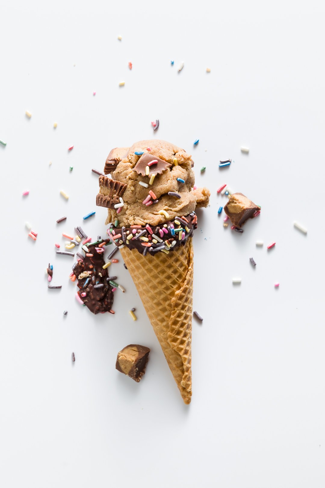Peanut Butter Cookie Dough in an ice cream cone with sprinkles
