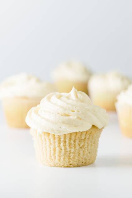 Vanilla frosting on vanilla cupcakes