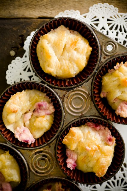 overhead view of a muffin tin loaded with mini cranberry cheese danishes