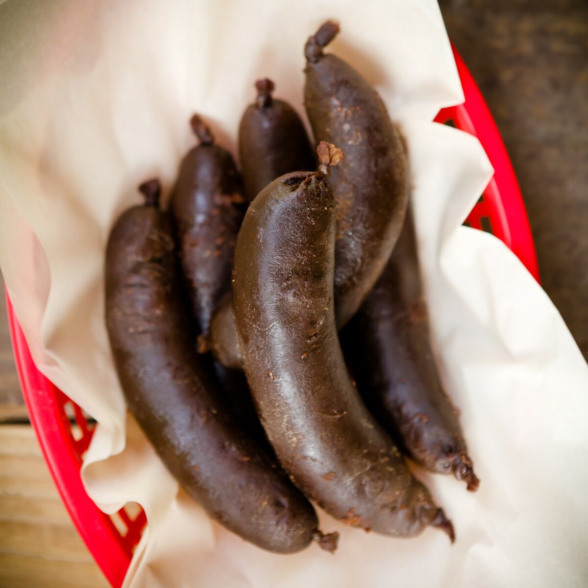 overhead view looking into a basket with six dessert sausages