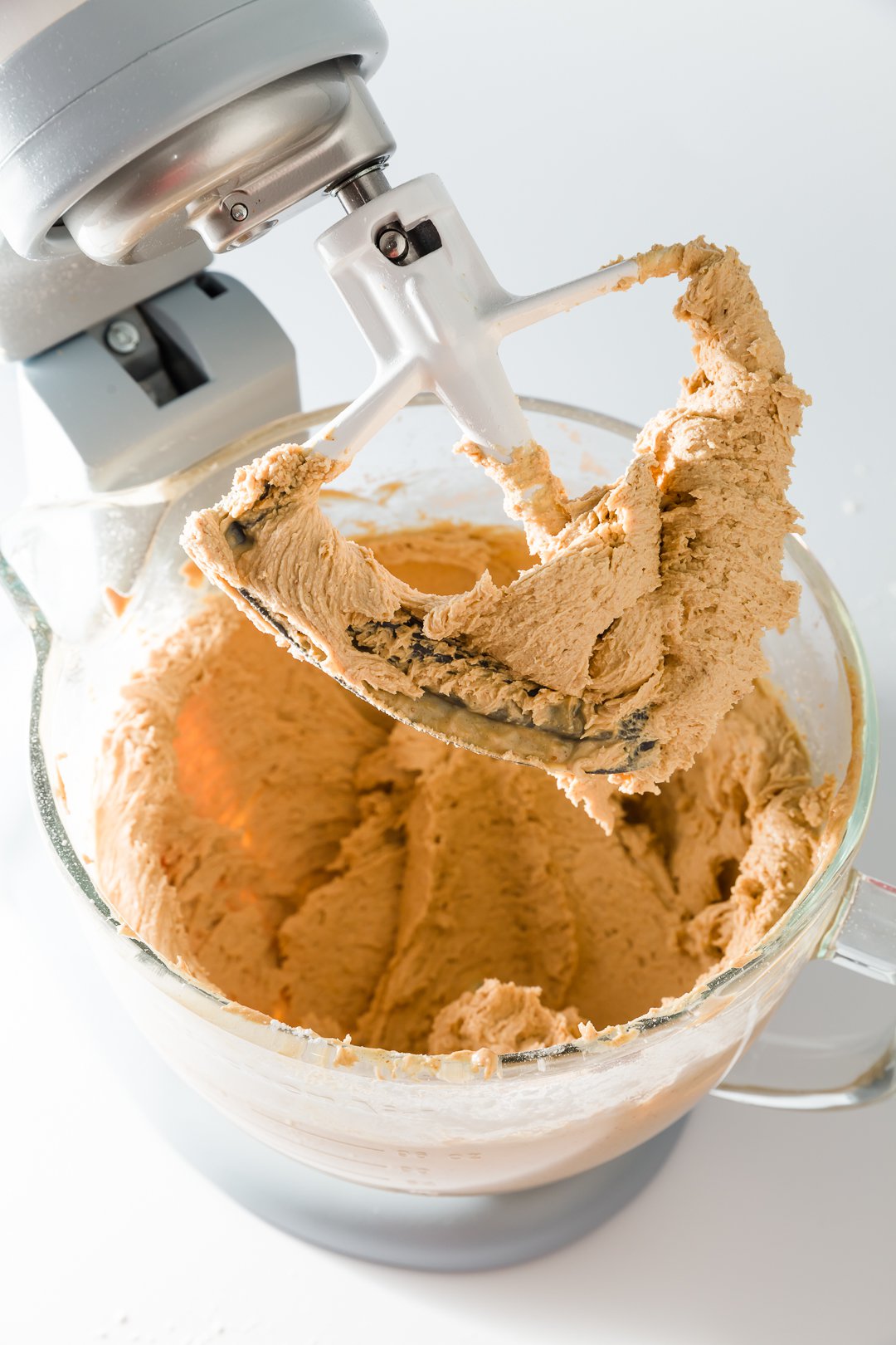 Peanut butter frosting on paddle of KitchenAid mixer