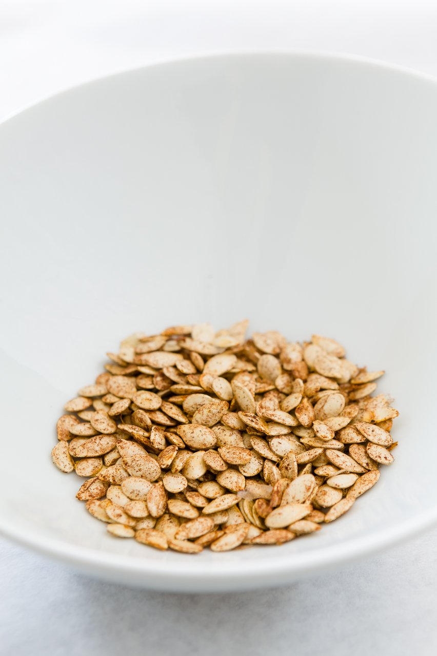 Toasted Pumpkin Seeds in a white bowl