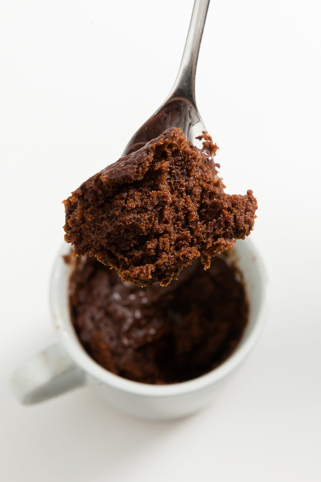 Chocolate mug cake on a spoon