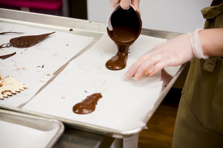 Pouring chocolate onto parchment paper