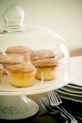 caramel frosting stuffed cupcakes on a cake stand