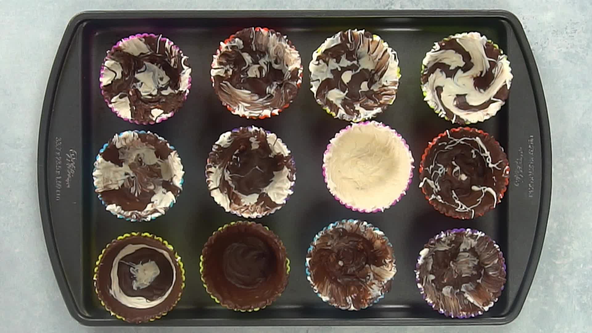 a tray of chocolate cups ready to go in the refrigerator