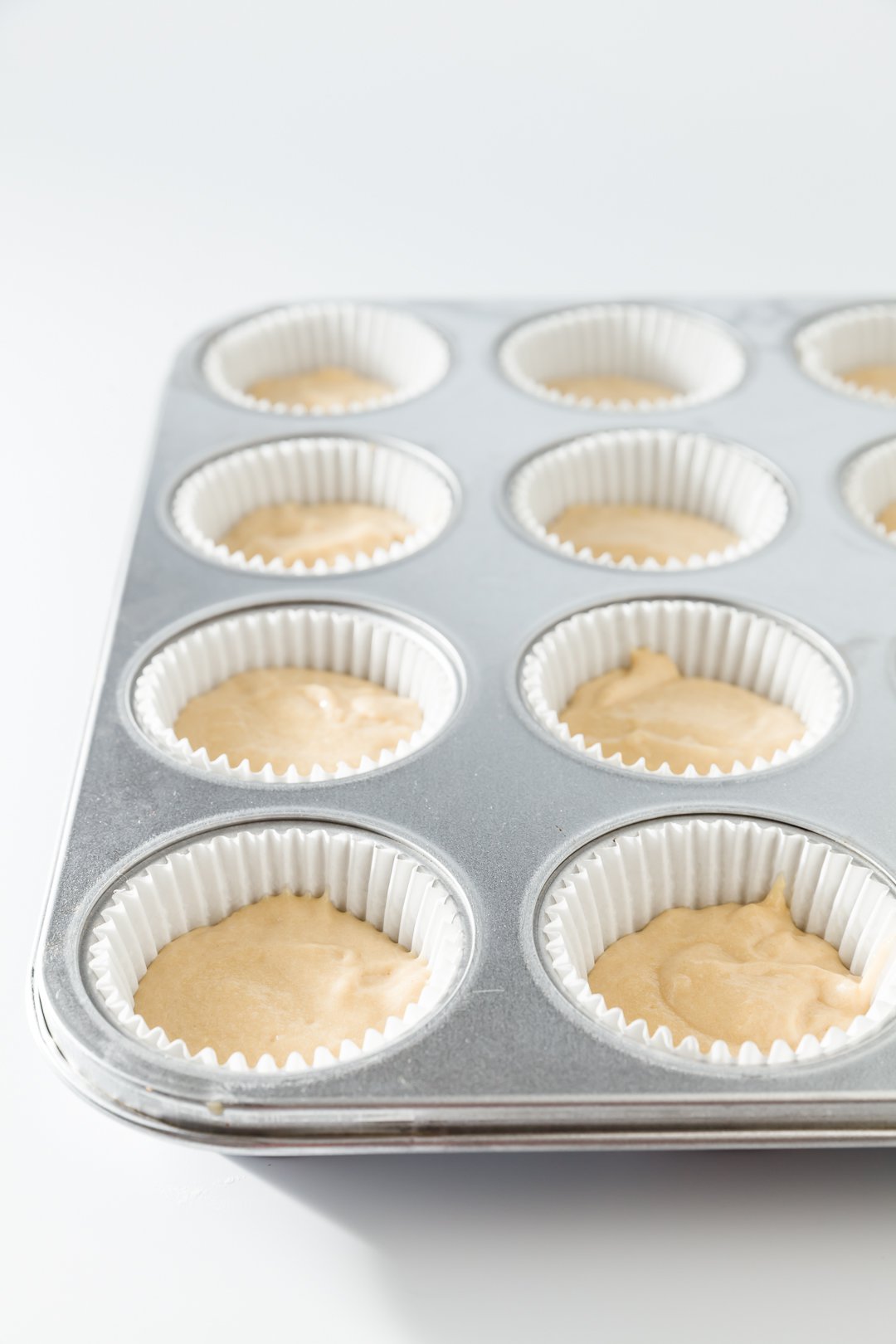 Cherry cobbler cupcake batter in cupcake tins