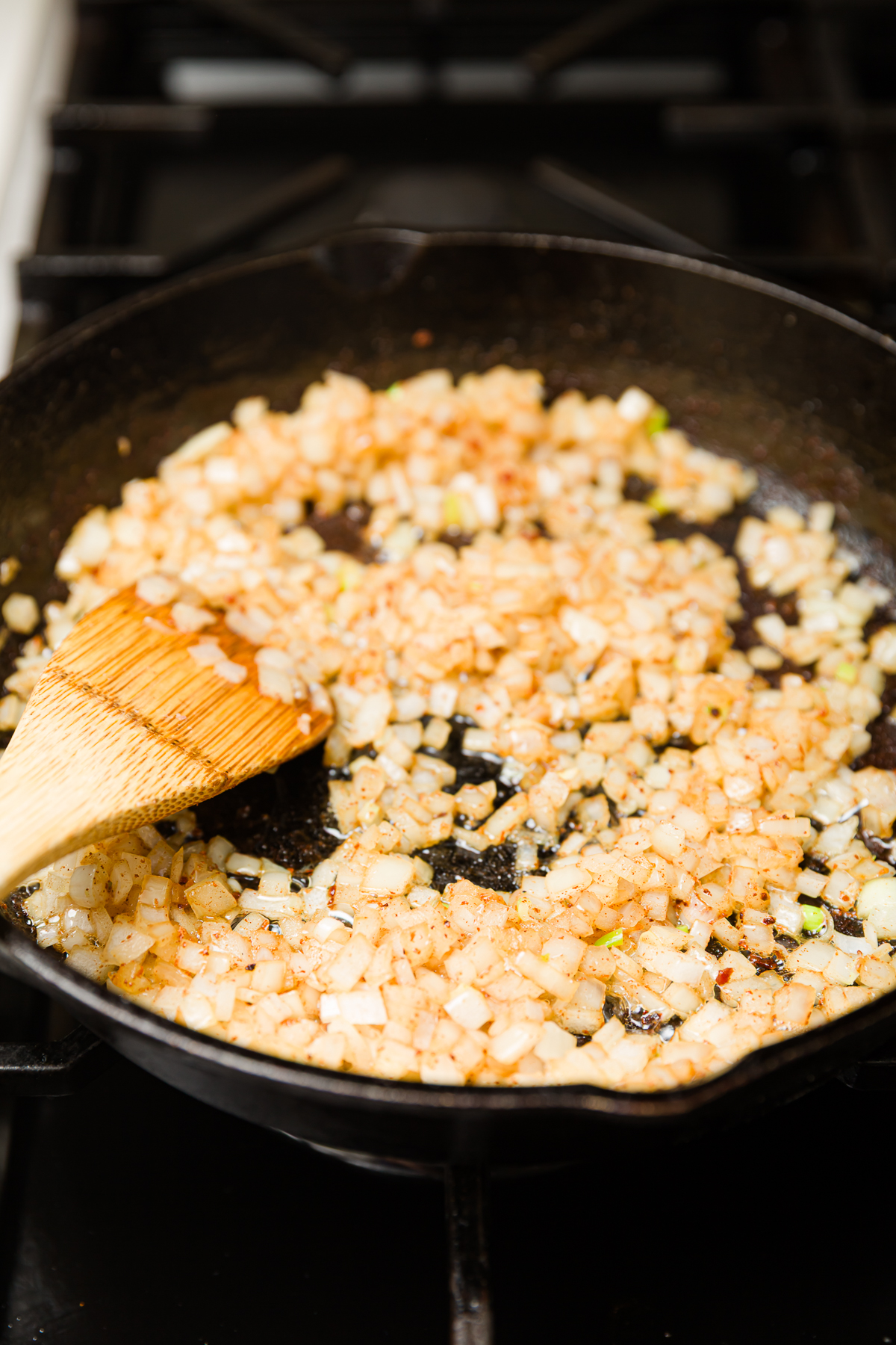 diced onion cooking in bacon fat