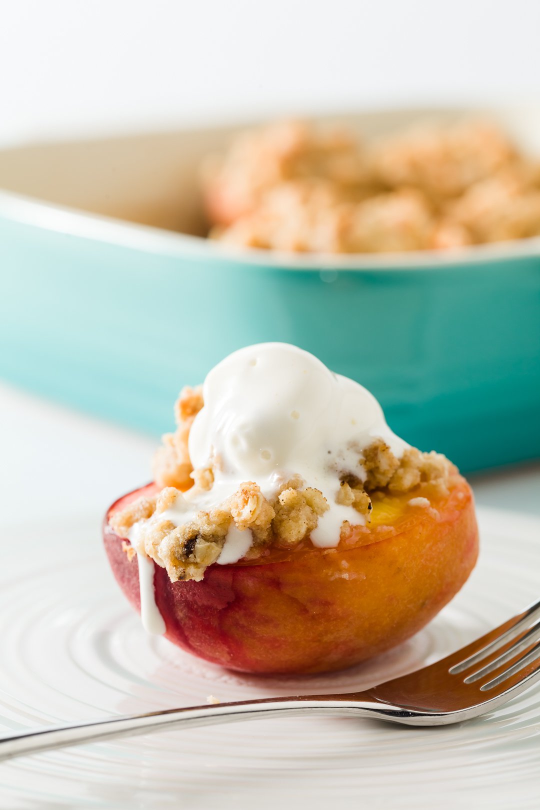 Baked peaches with dripping whipped cream