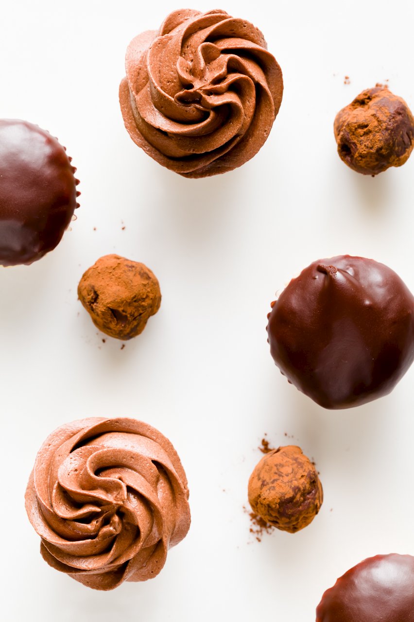 Overhead view of different desserts prepared using chocolate ganache