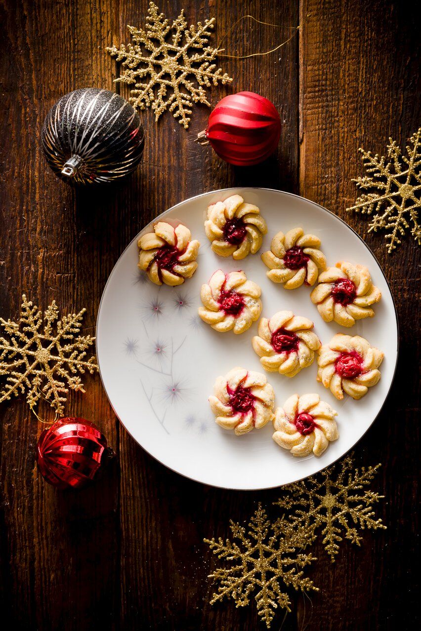 Spritz Cookies on a plate decorated for Christmas