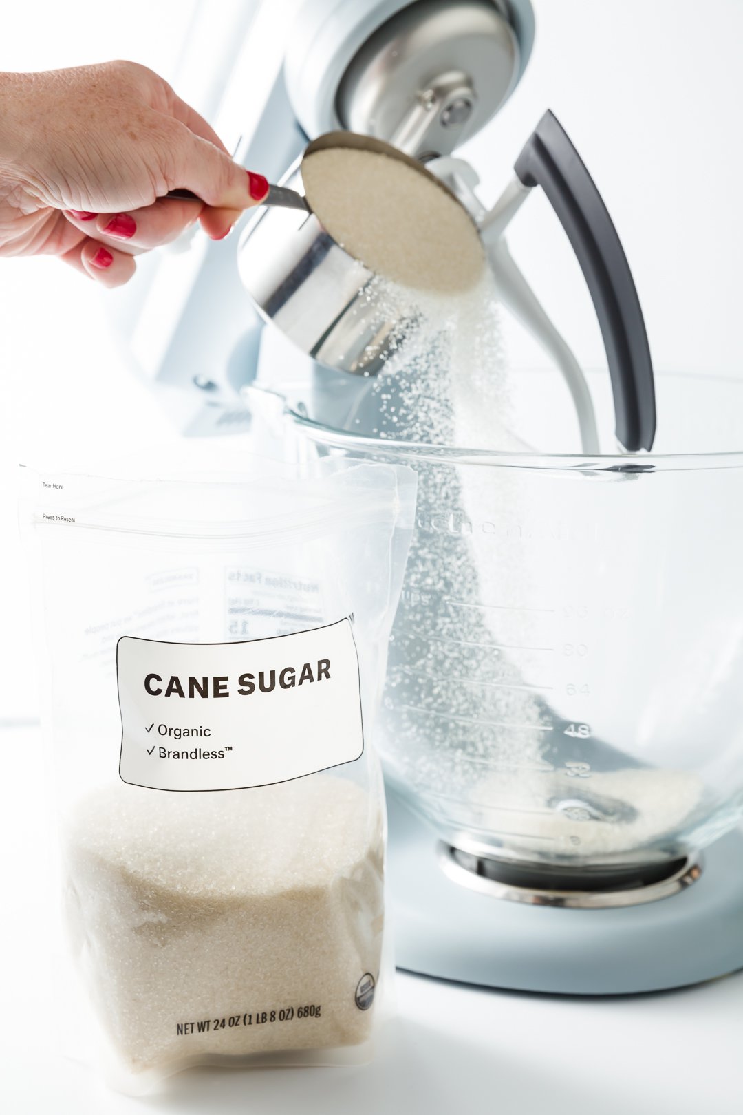 Adding sugar to a mixer