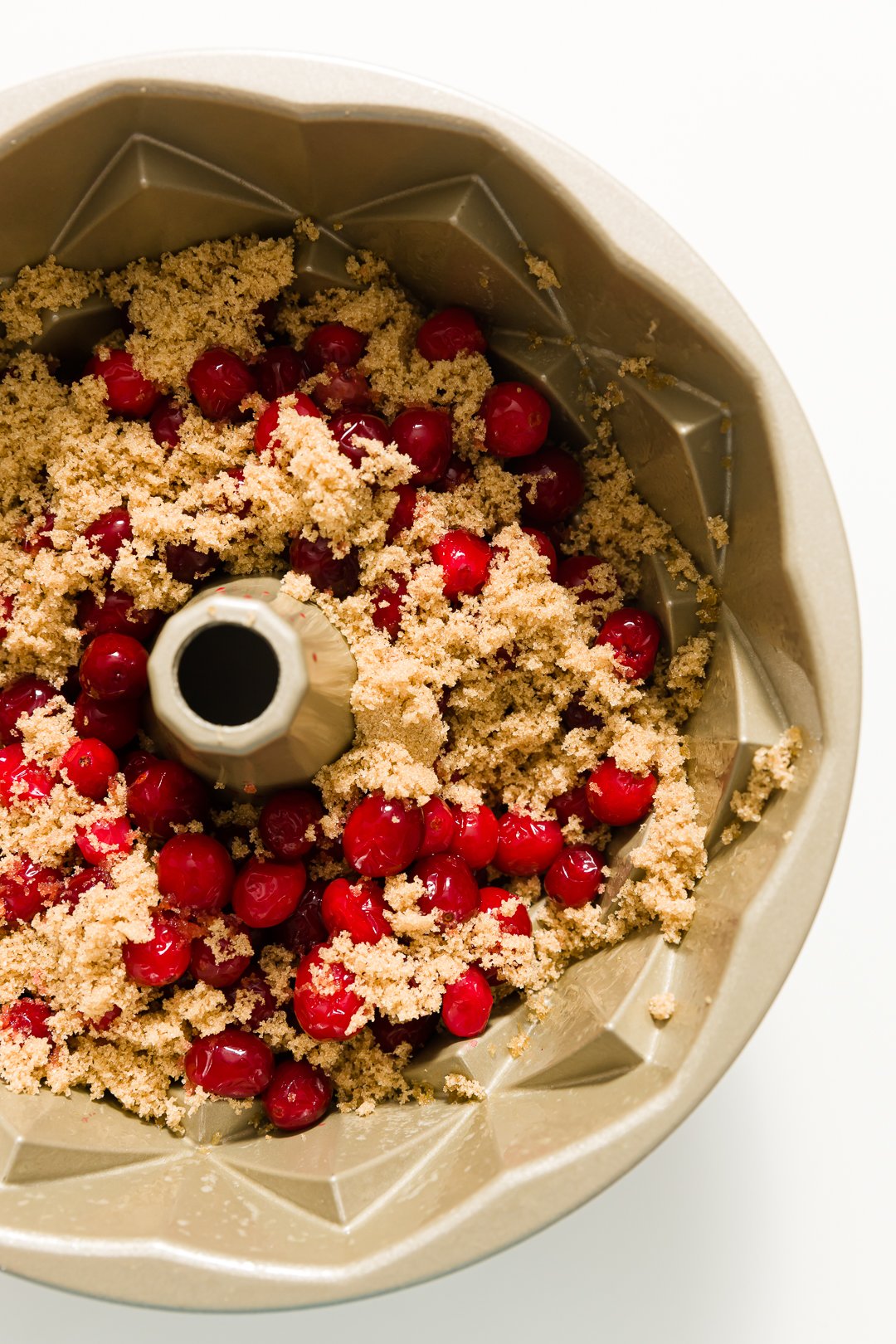 Brown sugar and cranberries in a bundt pan