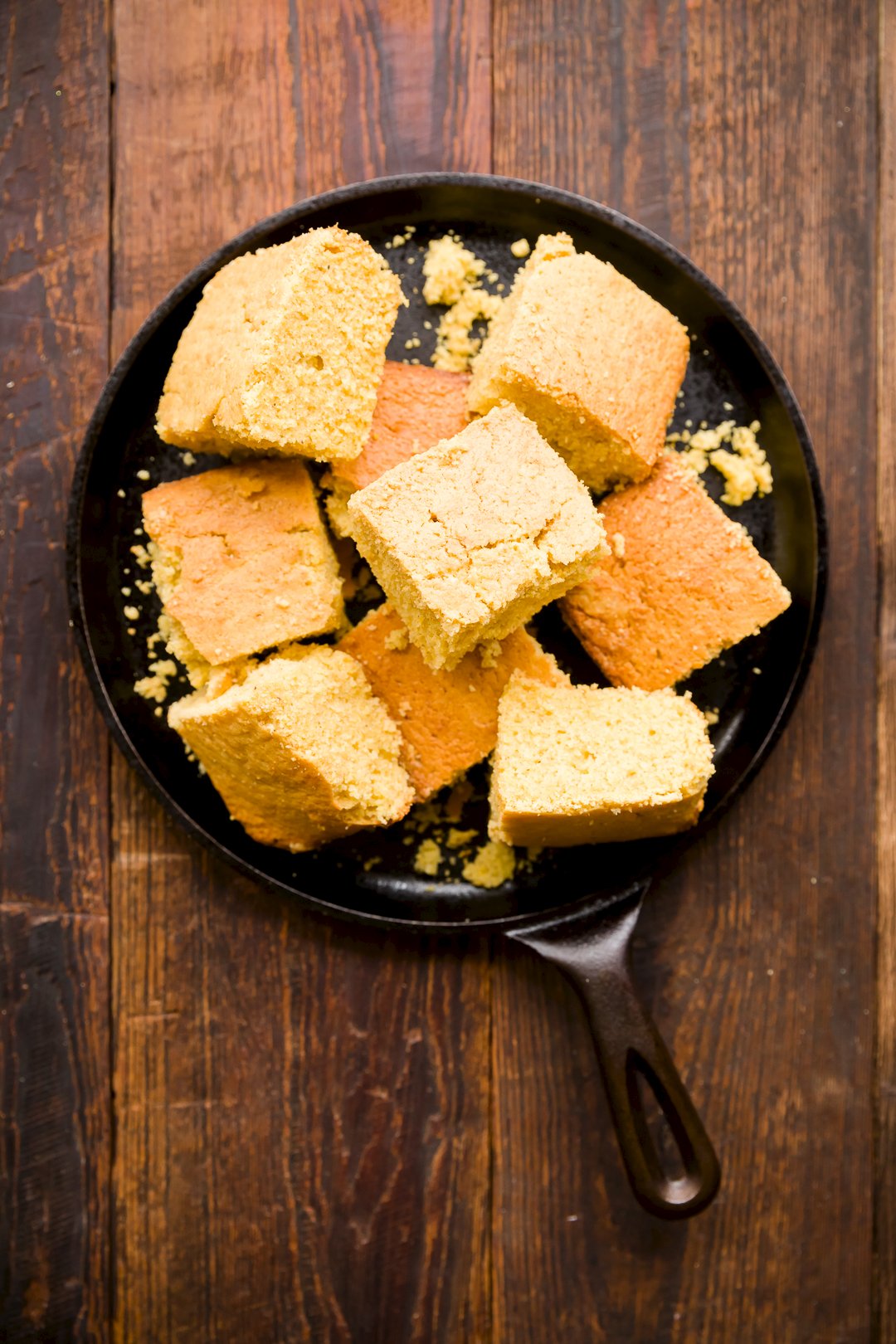 Cornbread pieces in a cast iron skillet