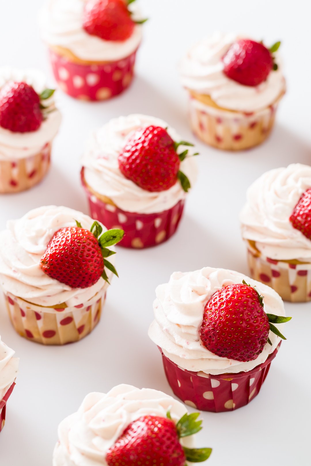 Vanilla Cupcakes With Strawberry Whipped Cream Frosting