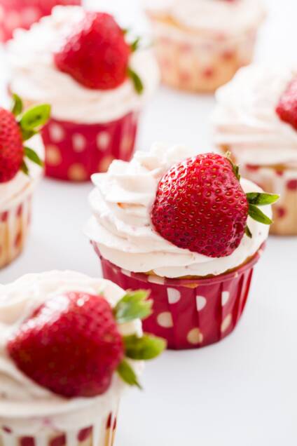 Vanilla Cupcakes With Strawberry Whipped Cream Frosting