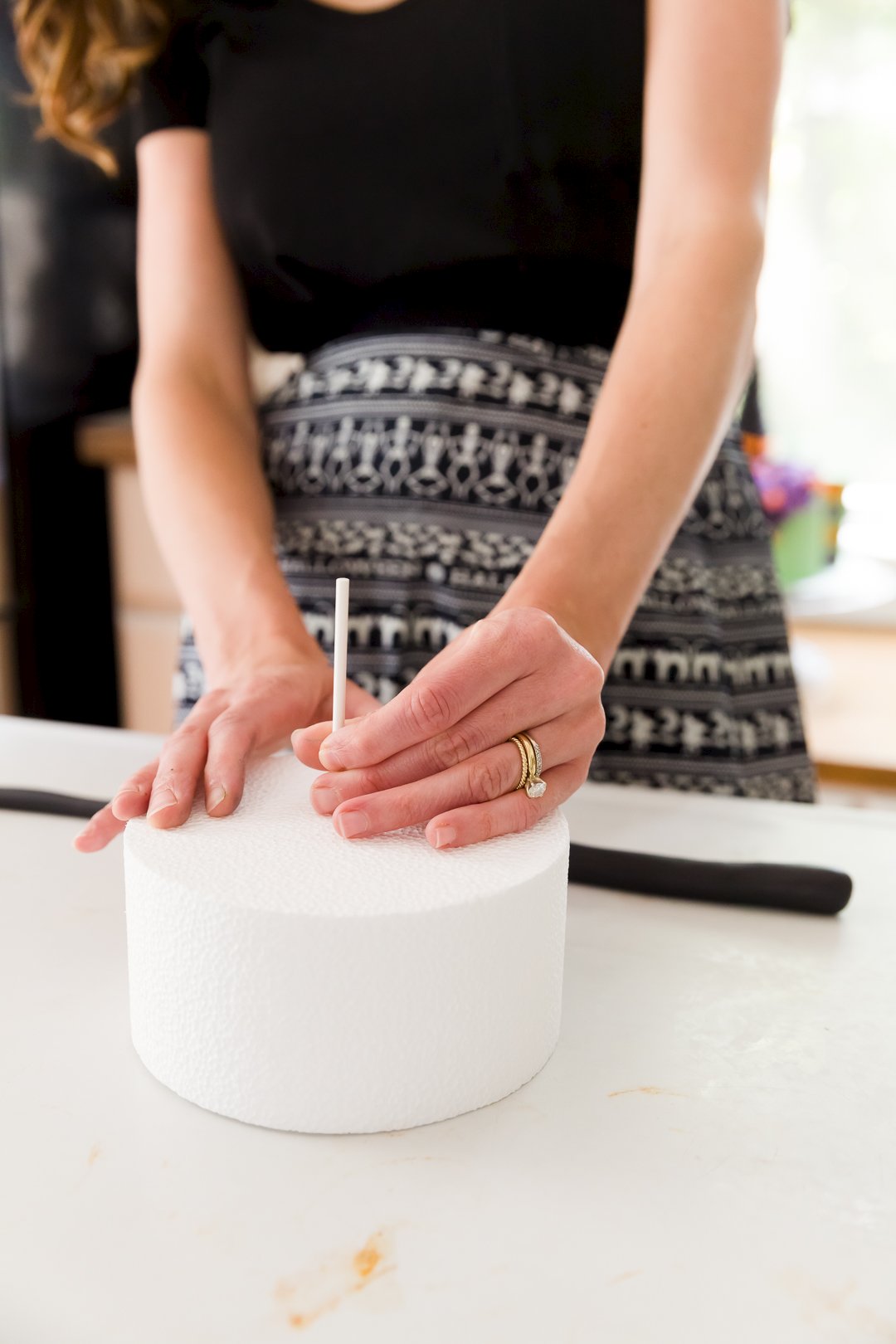 Place a Popsicle stick in a styrofoam dummy