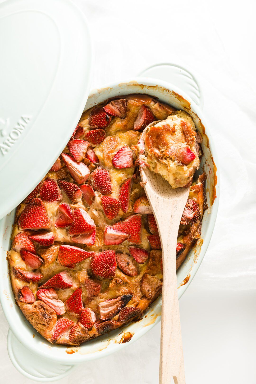 Strawberry brioche French toast in a casserole dish