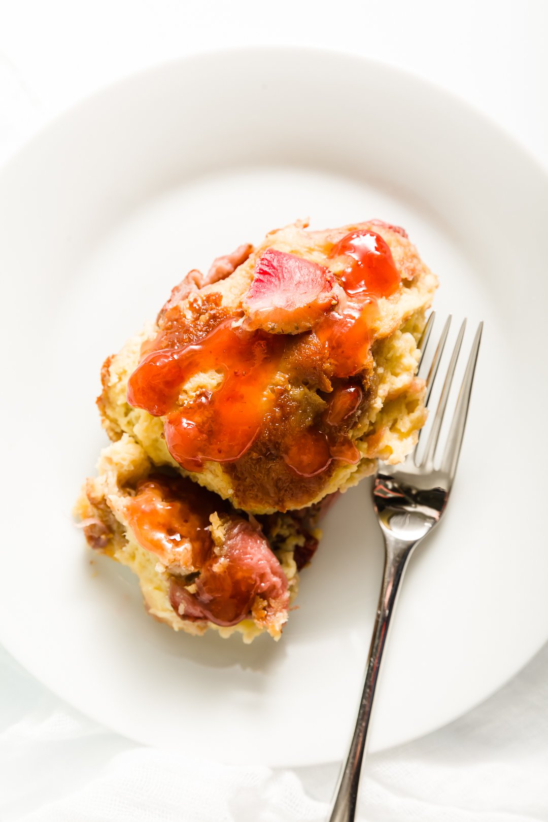 slice of brioche French toast with strawberry jam on it