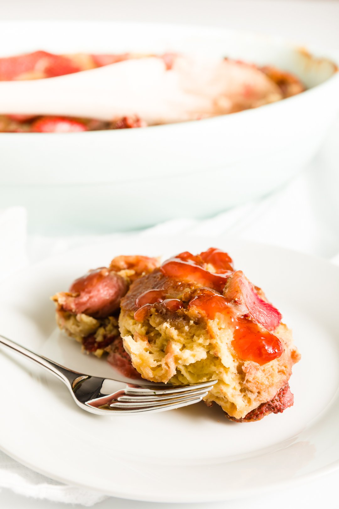 Piece of strawberry brioche French toast on a plate