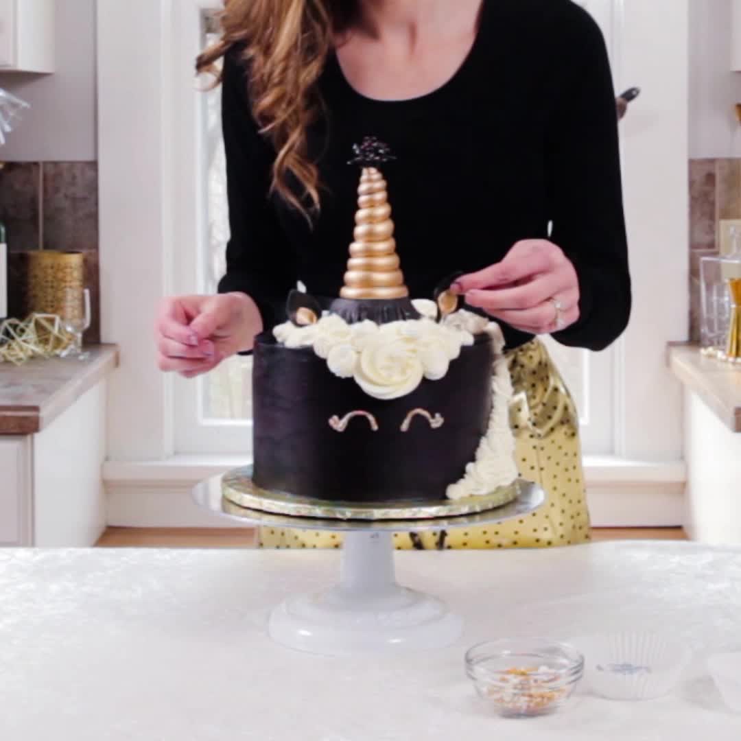 adding unicorn ears to new years cake