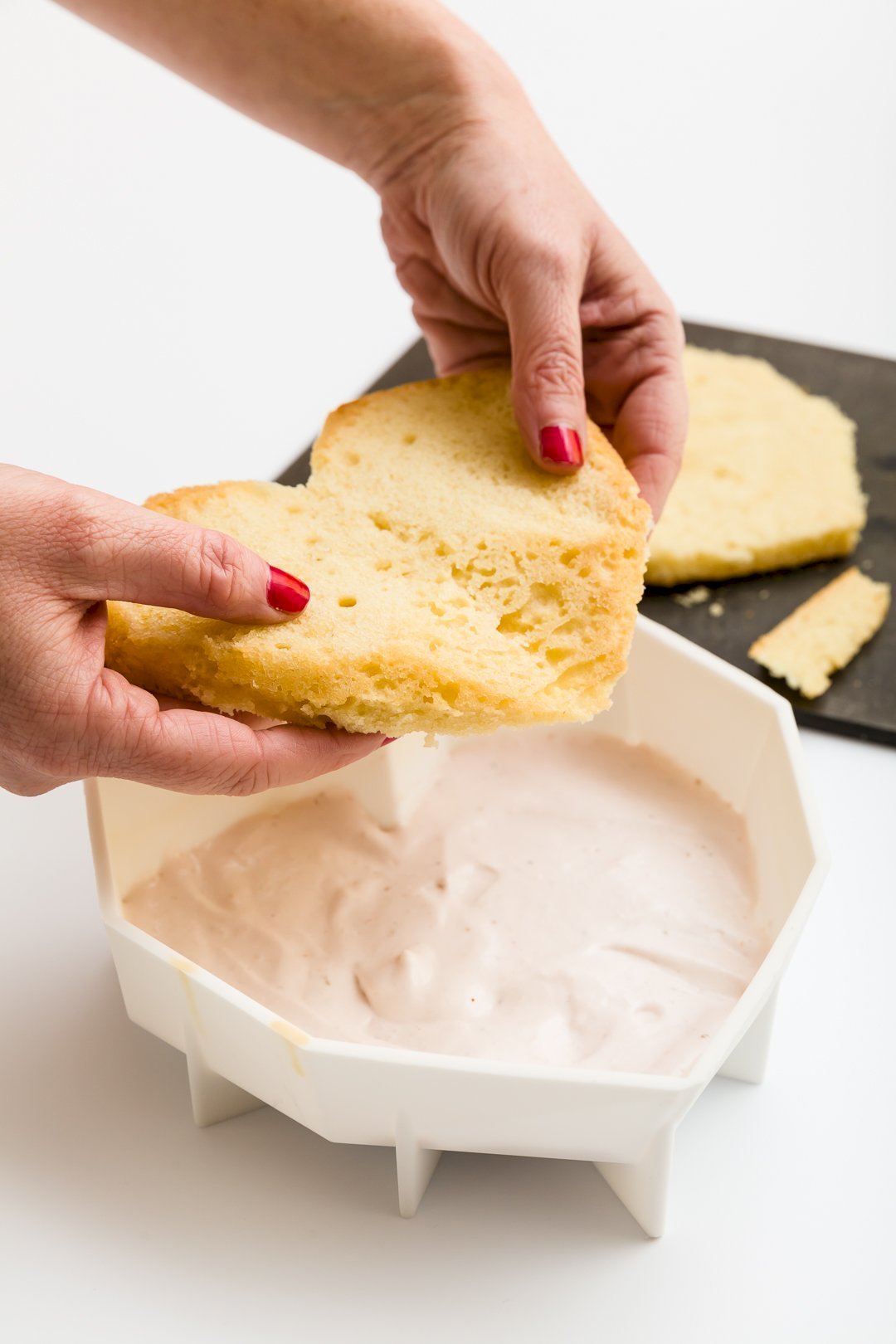 Adding cake to pan