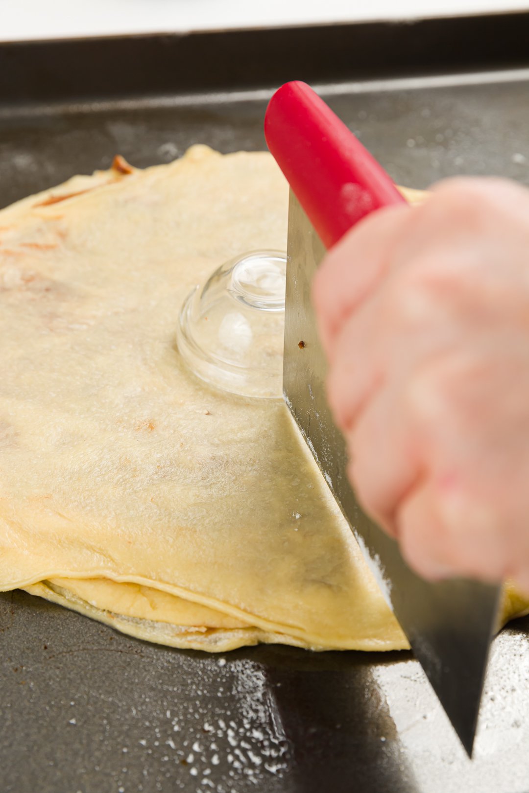 Cutting dough with a bench scraper