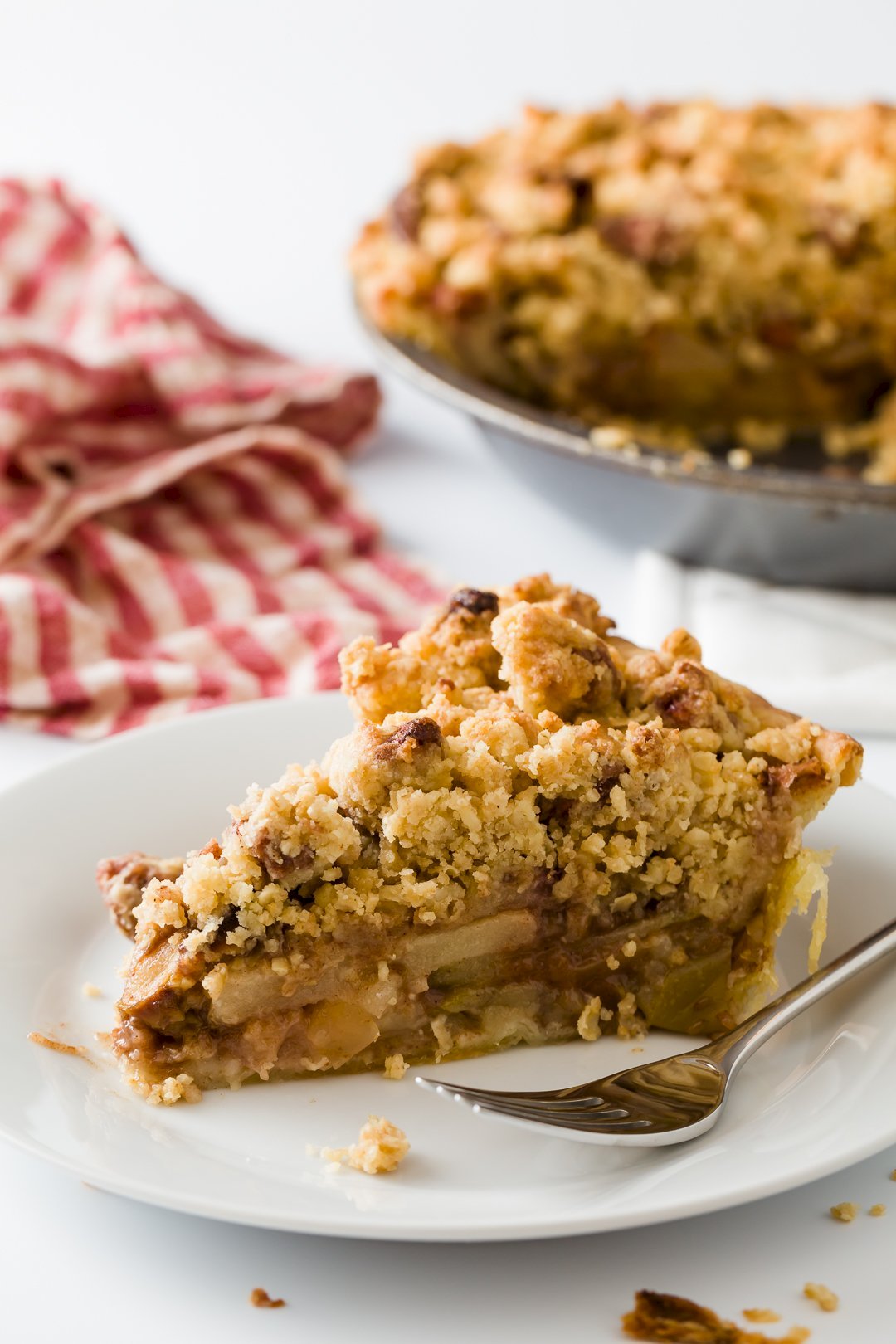 slice of Dutch apple pie on a small white plate