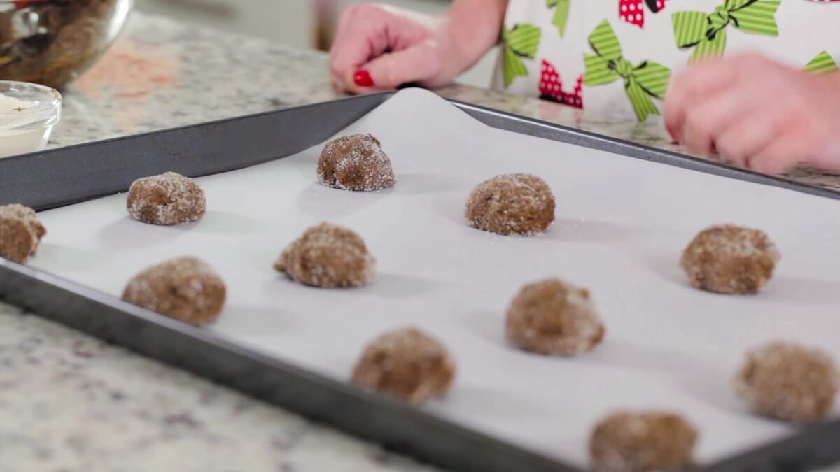 A tray of cookie dough ball rolled in sugar