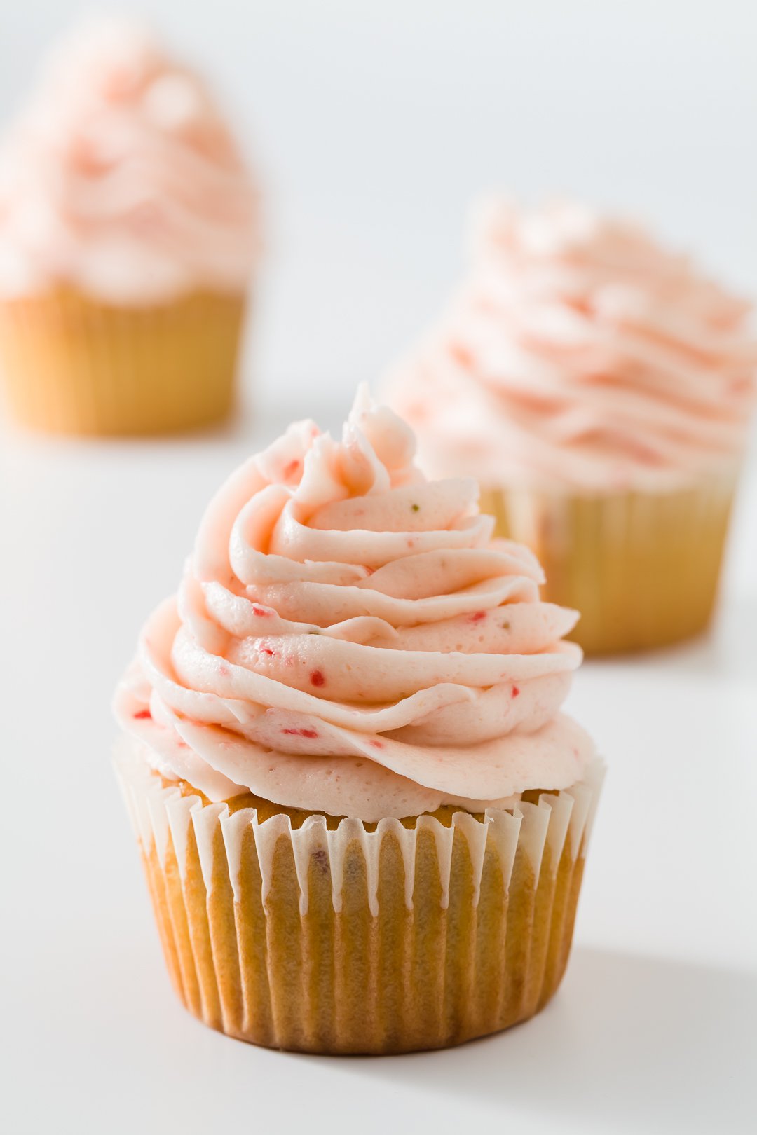 vanilla cupcakes with strawberry frosting