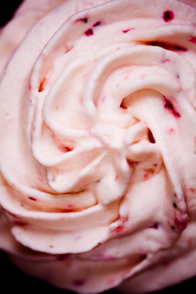 Very tight shot of strawberry whipped cream