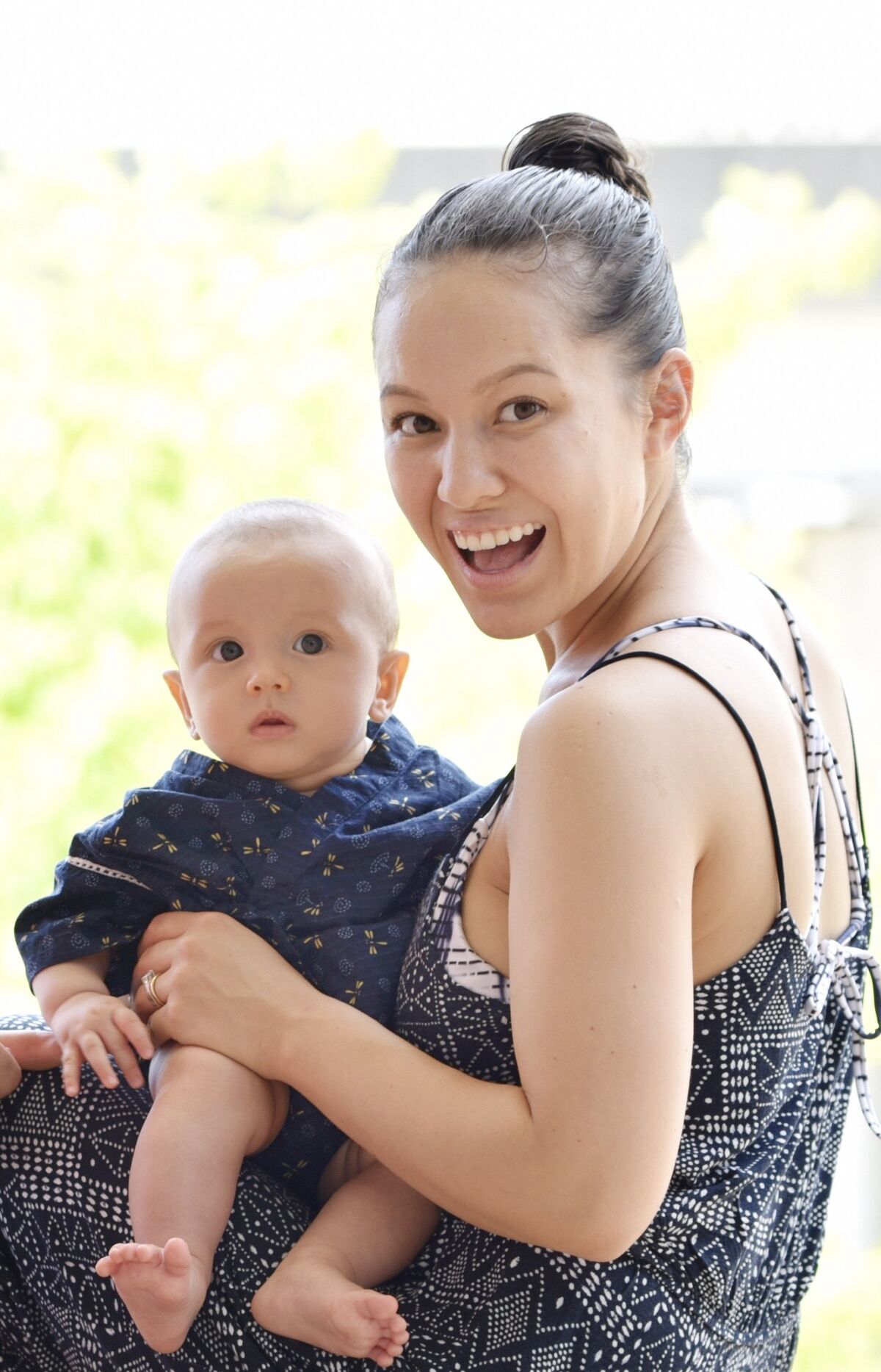 Ai sitting with her baby on her lap