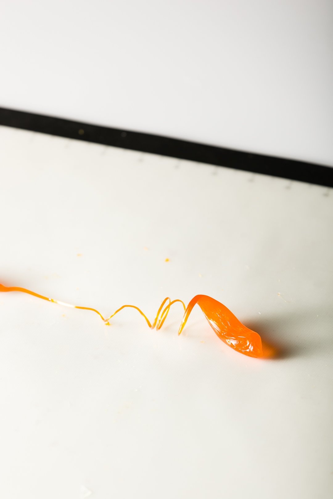 Completed orange isomalt curl